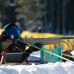 Steve Baskis shooting an audio rifle during a biathlon race