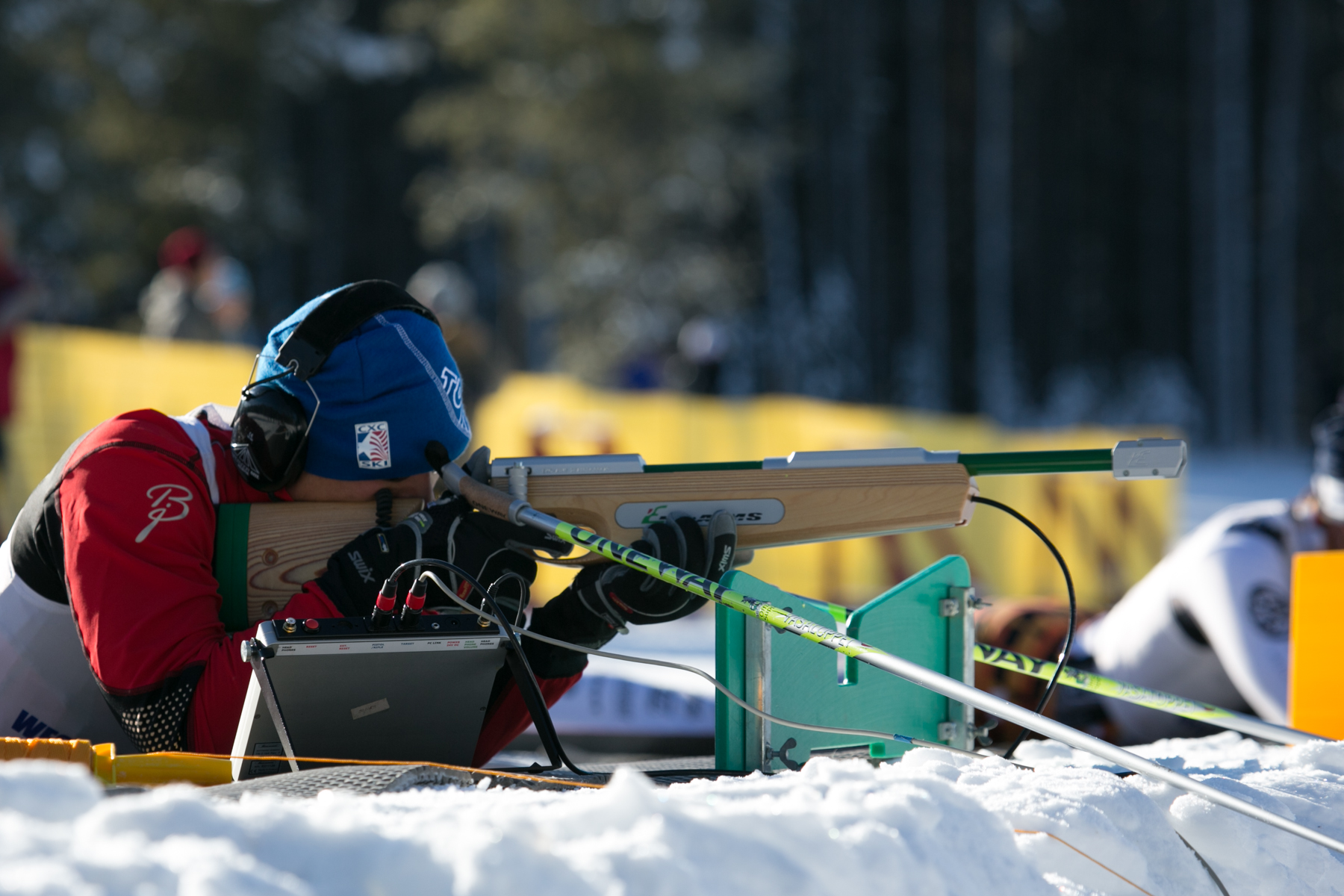 Steve Baskis shooting an audio rifle during a biathlon race